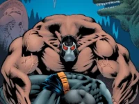 Batman Knightfall Vol 1 paperback comic book displayed on a wooden shelf