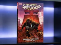 Collector's edition Spider-Man: Kraven's Last Hunt comic book on display in a geek-themed shelf with neon lighting. Cover highlights Spider-Man in his black suit emerging from a grave during a storm.